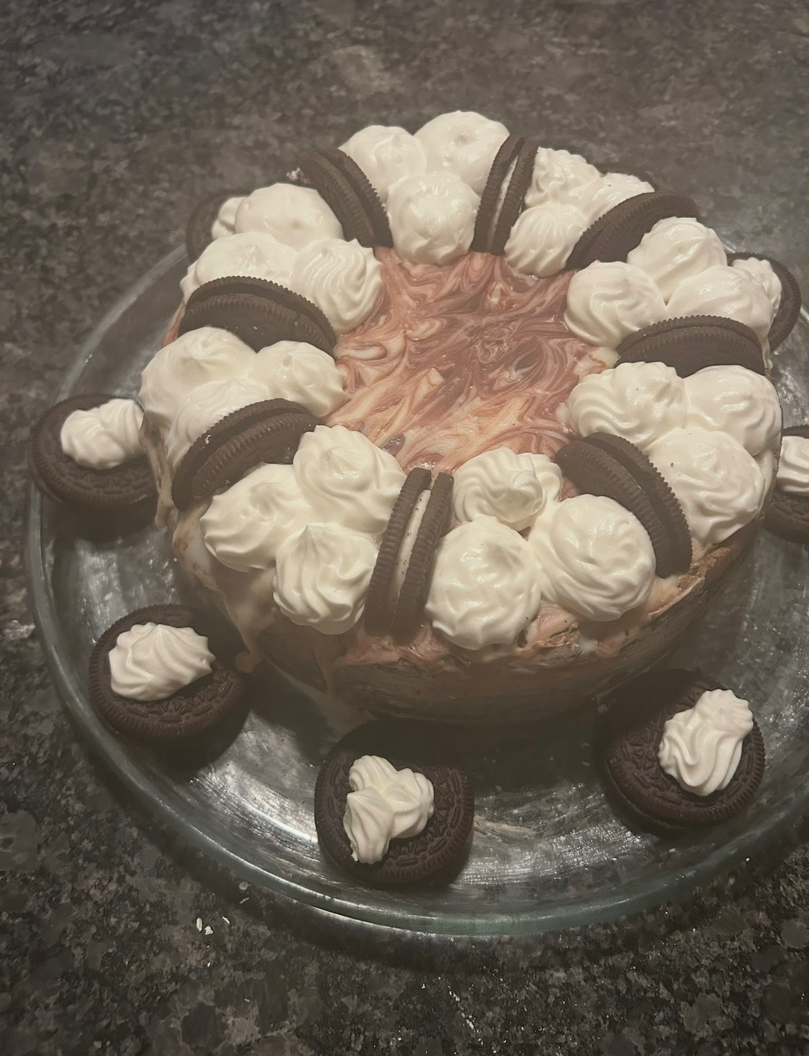 Cookies and cream dessert topped with sandwich cookies